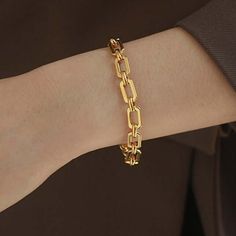 ✦ Make a statement with our bold 18K gold plated bracelet, crafted in a thick chain style for an eye-catching look. Designed to elevate your wrist with timeless elegance, this bracelet is perfect for adding a touch of sophistication to any outfit. With its bold design and luxurious gold plating, it's the ultimate accessory for making a chic and confident impression. ----------- DETAILS ----------- - Color: Gold - Size (Length x Width): 17.8cm x 0.7cm - Materials: Brass, 18K Gold Plated - SKU: QT Luxury Gold Oval Chain Jewelry, Luxury Oval Link Chain Bracelets, Luxury Chic Oval Link Bracelet, Modern Chunky Link Bracelets, Modern Chunky Chain Link Bracelets, Modern Chunky Link Bracelet, Modern Chunky Gold Bracelets, Modern Chunky Bracelets For Everyday, Chunky Elegant Bracelet For Everyday