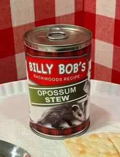 a can of billy bob's opossum stew next to crackers