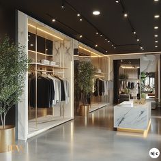 the interior of a clothing store with marble and gold accents