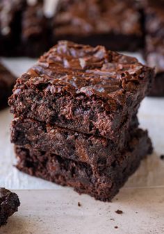 chocolate brownies stacked on top of each other