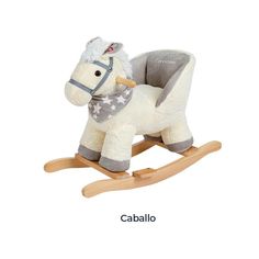 a toy rocking horse with a blanket on it's back and the words caballo written in spanish