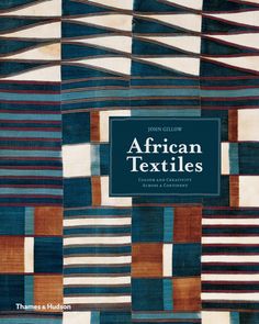 an african textiles book with blue, brown and white squares on the front cover in black