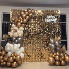 balloons and streamers in front of a gold sequin backdrop