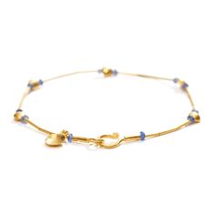 24K yellow gold, sapphire beads 1.50cts total weight Preserving a piece of history from Ancient Anatolia, Fatih translates the master craftsmanship of prehistoric eminence into contemporary works of art. As show with: Gold and Emerald Bracelet, Gold and Ruby Bracelet, and Gold and Lapis Bracelet. • 7.75" (19.69cm) length • 0.17" (0.43cm) maximum width • Hook and eye clasp Emerald Bracelet Gold, Lapis Bracelet, Gold And Emerald, Sapphire Beads, Ruby Bracelet, Emerald Bracelet, Sapphire Bracelet, Bracelet Gold, The Master