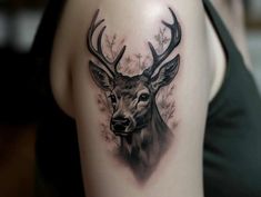 a woman with a deer head tattoo on her arm