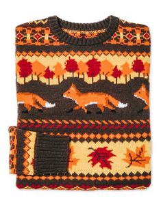 an orange and brown sweater with foxes on it