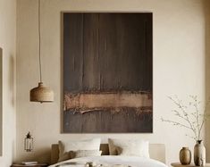 a large painting hanging above a bed in a room with white walls and flooring