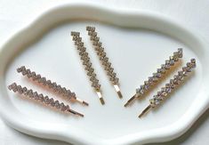 Add a touch of elegance to your hairdo with these shiny crystal  bobby pins. The perfect hair accessories for any occasion, especially weddings.  Made from high quality metal and avaliable in rose gold, gold and indecresent colour, making them a great addition to any bridal or bridesmaid outfit.  Can be worn at proms, party and other formal occasions. You will receive 1 pair of hair clip for the price. Measurements: length Ship with Royal Mail. Express delivery available at checkout. Thank you f Wedding Rose Gold, Sparkly Hair, Colour Making, Wedding Barrettes, Wedding Rose, Bridesmaid Outfit, Rose Gold Wedding, Rose Wedding, Perfect Hair