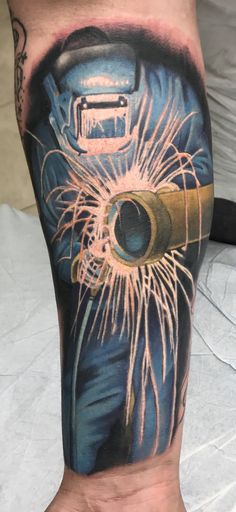 a man's leg with a tattoo that has an image of a camera on it