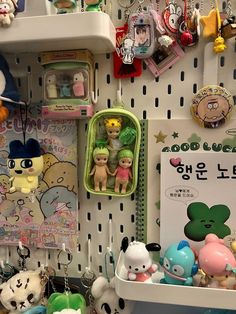 many small toys are hanging on the wall