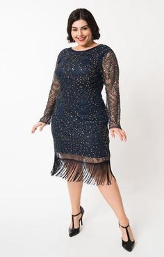 The Marchelle  Cocktail Dress is a striking beauty for nighttime frolics. Featuring a lovely navy blue mesh, this vintage-inspired cocktail dress features a sparkling array of gunmetal beads, silver sequins, and black embroidery. The lining is a dark navy blue.  The modest neckline drops into a v-back while sheer long sleeves provide vintage era grace while dripping fringe swings around your knees for perfect 1920s style. Outfitted with a back zipper!Available in sizes S-3X while supplies last. Navy Blue Sequin Cocktail Dress, Vintage Inspired Cocktail Dress, Beaded Flapper Dress, Silver Cocktail Dress, Unique Vintage Dresses, Modest Neckline, 20s Fashion, Vintage Inspired Fashion, Black Embroidery