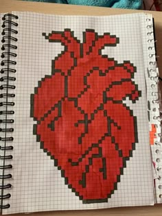 a notebook with a drawing of a heart on it