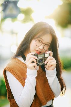 a woman taking a photo with her camera