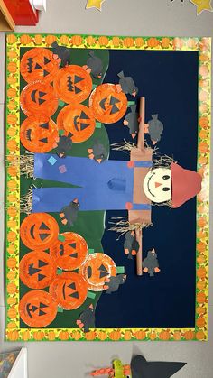 an art project with paper cutouts and pumpkins