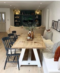 a wooden table sitting in the middle of a living room