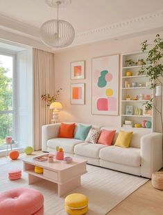 a living room filled with lots of furniture and colorful pillows on top of it's couches