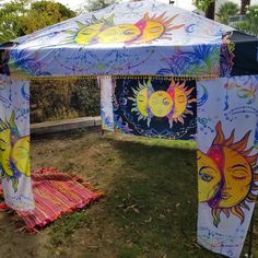 a tent with sun and moon designs on it