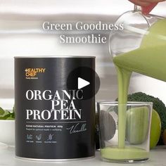 a can of organic pea protein being poured into a glass next to an apple and broccoli