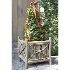 a wooden planter with plants growing out of it