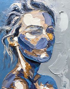 an abstract painting of a woman's face with blue and gold paint on it