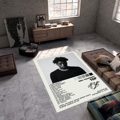 a living room filled with furniture and a large poster on the wall next to it