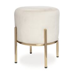 a white stool with gold legs and a round foot rest on it's side