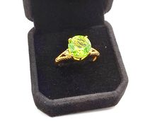 The Center piece of this Karis ring is the striking chartreuse quartz triplet showcasing a vibrant and unique green yellow hue that is sure to make a bold impression. The 18k yellow gold plating adds to the craftsmanship . The Karis collection where innovative design meets authentic artistry to create unique and breathtaking jewelry. Size 10  MSRP ($199.99) Lime Green Diamond Ring With Gemstone, Handmade Green Chrysoprase Ring, Fine Jewelry Lime Green Gemstone Ring, Lime Green Gemstone Ring Jewelry, Chartreuse Jewelry, Green Diamond Ring, Green Diamond Rings, Green Diamond, Innovative Design