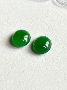 "This listing is for two pieces of emerald green icy cabochon jadeite jade as shown in the photos.  These two are icy and are very clean. They do show natural characteristics of the mother nature but are hard  to see unless under the light.  Price has reflected the imperfection. Approx. measurement：6.8mm L x 6.0mm W x 3.0mm D and 6.9mm L x 6.0 mm W x3.0mm D Approx. weight: less than 1 gram Please note these are small but are great for stub earring. This listing includes the jadeite cabochons as shown in the photos,  photo copy of the original certificate and a beautiful gift box. US domestic shipping is Free. Shipping via Priority Mail package with signature requirement.    We have a 14-Day Return or Exchange from the date of delivery policy and buyer pays for returns unless it is due to o Mail Package, Diamond Bar, Earring Studs, Under The Lights, Ring Setting, Photo Photo, Beautiful Ring, Beautiful Gift Boxes, Mother Nature