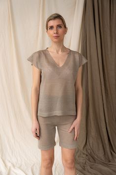 100% linen yarns blouse in beige colour is hand knitted in small family business based in Lithuania. Minimalist style relaxed fit tee top is easy to wear, especially during hot summer days. Lightweight see through top is knitted from soft linen yarns which delivers best feeling whatever the weather. Did you like whole set? Check this here: https://www.etsy.com/listing/1211784735/knitted-linen-pajama-set-linen-home-wear?click_key=99a9eb22a2664787ed003d20f8faec182919a13e%3A1211784735&click_sum=7f181d8a&ref=shop_home_active_2&frs=1&sts=1 We are more than happy to offer tailor size garments! Feel free to send us your measurements and we will knit a perfect garment. Find more colours in photo gallery. All our knitted linen garments are made of 100% linen. Why linen? Because it's elegant, beauti Linen Sleepwear, Linen Pajamas, Linen Loungewear, Shorts High Waisted, Crochet Shorts, Linen Yarn, Beige Colour, Crochet Clothing, Summer Linen