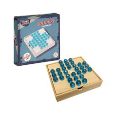 a wooden board game with blue marbles in the middle and an unopened box