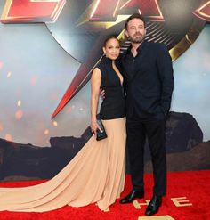 a man and woman posing on the red carpet at an event for the film's title