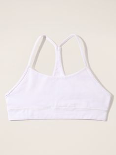 FOR: School, practice, and play FEEL: Organic cotton is lightweight and breathable FAVE: Super soft and stretchy straps don't dig into her shoulders Close to the body for live-in comfort. Casual Supportive Sports Bra With Adjustable Straps, Casual Stretch Sports Bra With Strappy Design, Casual Stretch Strappy Sports Bra, Casual Strappy Stretch Sports Bra, High Stretch White Cotton Activewear, White High Stretch Cotton Activewear, Sporty Tops For Light Exercise With Adjustable Straps, Cotton Sports Bra For Yoga, Sporty Tops With Adjustable Straps For Light Exercise