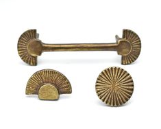 two antique brass door knobs on a white background