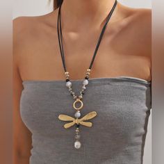 This Gorgeous Dragonfly Necklace Is A Must-Have For Any Fashion-Forward Individual. The Elegant Beading And Vintage Design Add A Touch Of Boho Chic To Any Outfit. Measuring 25 Inches With A 3 Inch Extension, This Necklace Is Perfect For Layering Or Wearing Alone. The Dragonfly Pendant Adds A Touch Of Whimsy To The Piece, Making It A Beautiful Addition To Any Jewelry Collection. It Is Brand New With Tags And Ready To Be Worn And Cherished. Item 03 Dragonfly Beaded, Clear Necklace, Large Pendant Necklace, Pearl Necklace Designs, Bold Necklace, Dragonfly Necklace, Pearl Decor, Boho Chic Jewelry, Long Necklaces