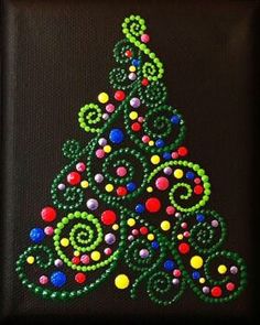 a beaded christmas tree is displayed in a black square frame on a dark background