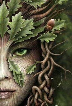 a woman's face with green leaves on her head and eyes painted to look like an elf