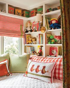 a bedroom with bookshelves filled with children's books and stuffed animals on the shelves