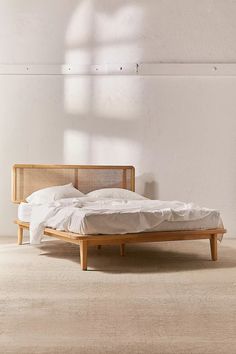 the bed is made up and ready for someone to use it in their home or office