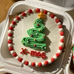 a decorated christmas cake in a foam container