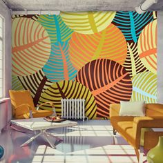 a living room with colorful wallpaper and chairs