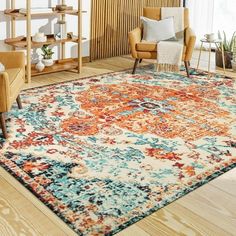 a living room with an orange and blue rug