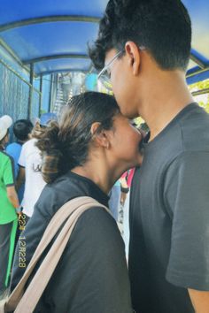 a man and woman standing next to each other