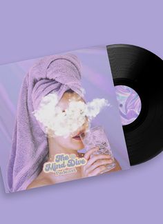 an album cover with a woman in a towel blowing bubbles on her face