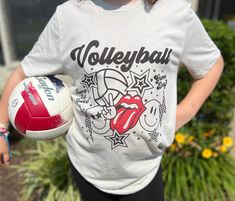 Bump, Set, Spike! This printed shirt features a trendy smiley volleyball design. I use Bella Canvas unisex shirts -- shown color is heather dust. Fun Sports Graphic Print Tops, Fun White Sports T-shirt, Playful Sports Tops With Letter Print, Playful Graphic Print Sports Tops, Fun Sports Tops With Letter Print, Bump Set Spike, Volleyball Design, Volleyball Designs, Measuring Stick