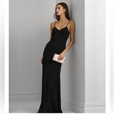 A Radiant Choice For Your Next Occasion, This Lauren Ralph Lauren Gown Unites A Glamorous Column Silhouette With A Contemporary Twisted Detail At The Back Waist And Chain-Trimmed Straps. The Smooth Hand Of Stretch Jersey Affords A Fluid Drape And Ease Of Movement. Imported Twisted Detail At The Center Back Waist Chain-Trimmed Spaghetti Straps Sleeveless Silhouette Column Silhouette Bust Darts Pull-On Styling Fully Lined V-Neck V-Back Elegant Black Floor-length Slip Dress, Black Evening Gown With Spaghetti Straps, Black Spaghetti Strap Evening Gown, Evening Maxi Dress With Sweep Train And Spaghetti Straps, Formal Dress With Spaghetti Straps And Sweep Train, Formal Dresses With Sweep Train And Spaghetti Straps, Classic Evening Dress For Prom, Formal Evening Dress With Sweep Train And Spaghetti Straps, Formal Spaghetti Strap Evening Dress With Sweep Train