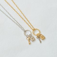 "Lock & Key Necklace on Ring with an optional hand-stamped initial tag - available in gold and silver finish. These will make a perfect gift for your best friend and sisters or any loved ones. D E T A I L S - Delicate Lock and Key pendants hung on the ring - Ring size: 12x12mm - Key size: 6x12mm - Color choice: gold chain with a silver key or silver chain with a gold key - It can also be a bracelet depending on the chain length - Each piece or set comes in a gift box, ready for gifting. - Th Initial Heart Necklace, Key Bracelet, Stamped Bracelet, Friendship Jewelry, Locks & Key, Symbol Necklace, Ball Necklace, Key Necklace, Key Pendant