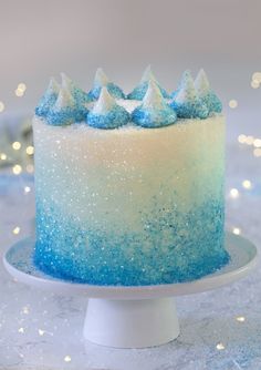 a cake with blue and white frosting on a plate