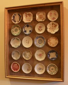 a display case with many different plates on it