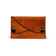 The perfect purse, wallet for the minimalist person. Two compartments closed with snap fasteners make it possible to sort money and cards. Made from fine, robust cowhide leather. The classic design is practical and fits any everyday style. Minimalist Leather Rectangular Coin Purse, Minimalist Brown Coin Purse For Daily Use, Brown Leather Coin Purse With Card Slots, Brown Minimalist Coin Purse For Daily Use, Minimalist Rectangular Leather Coin Purse, Classic Trifold Wallet In Cognac For Everyday Use, Classic Cognac Trifold Wallet For Everyday Use, Brown Coin Purse With Card Slots For Everyday, Brown Rectangular Wallet With Waxed Finish