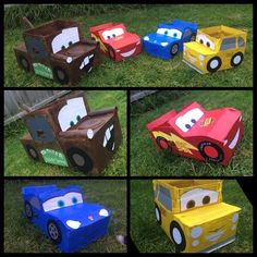 cars made out of cardboard boxes sitting in the grass